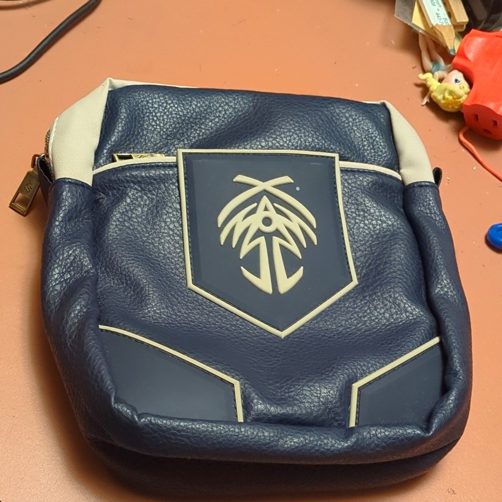 Stormlight crossbody bag Blue Beige small gold zip lined inner pockets logo